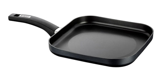 MONIX Resistent Plus - 28 cm square aluminum grill with non-stick coating, ideal for healthy cooking.