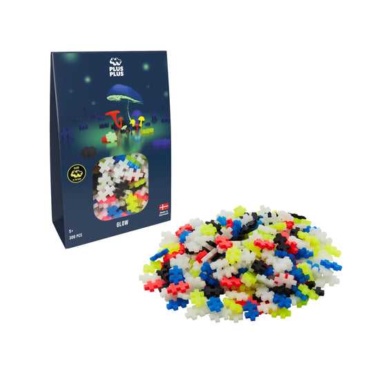 Plus-Plus 3975 Glow Construction Toy - 300 luminous building blocks for creative play in dark environments.
